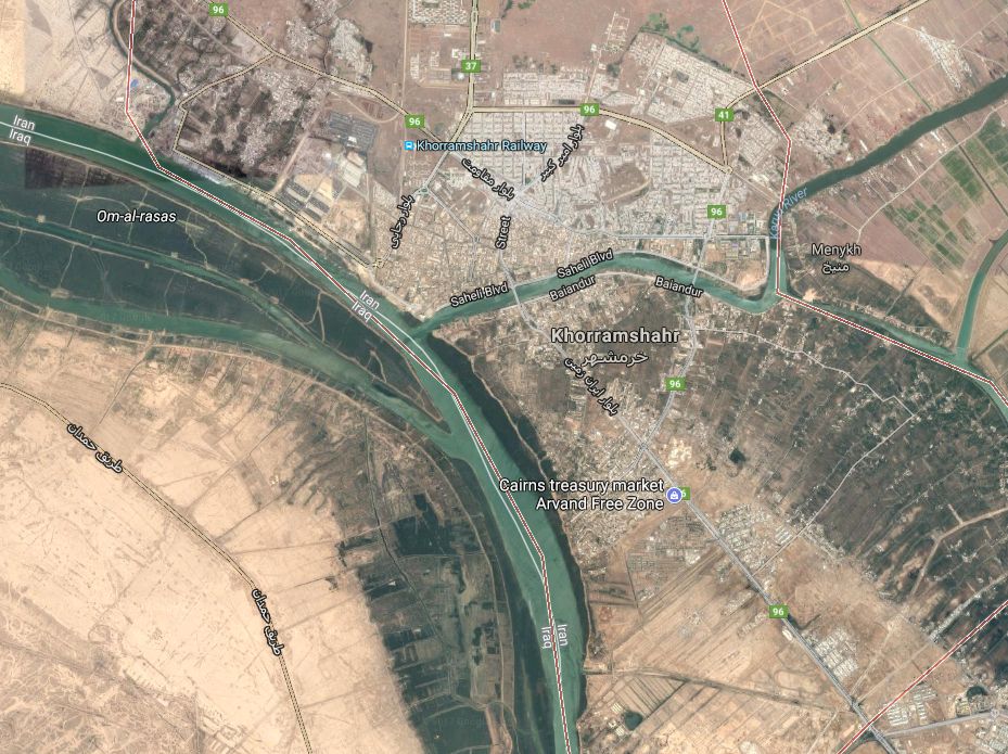 Aerial view of the city of Khorramshahr and surrounding areas including rivers, roads, and agricultural fields. The rivers are visibly curved and several labels indicate key locations and roads, marking the bustling activities and urban layout.
