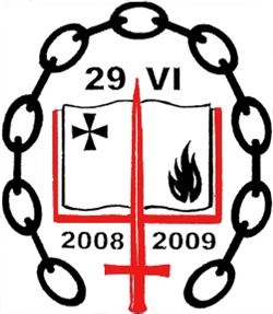 An emblem featuring a book-like icon enclosed in a circular chain link. The left page of the book depicts a star and the right page shows a flame. Below the book, a red cross intersects the date range 2008 to 2009, with the Roman numerals "VI 29" at the top.
