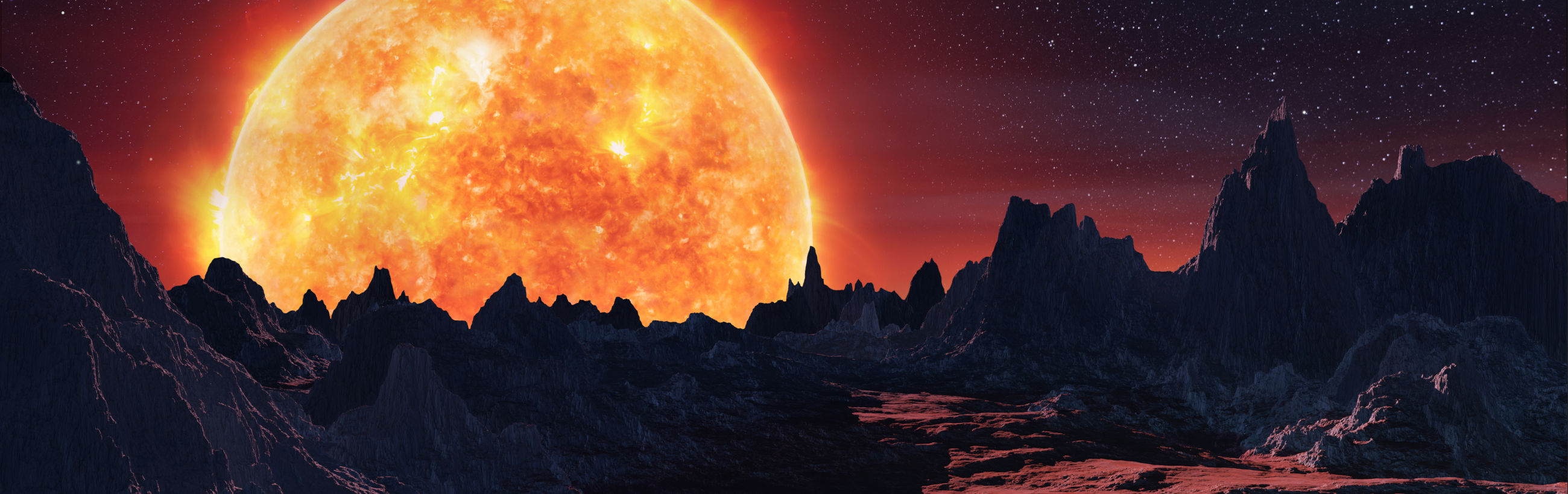 A panoramic view showing a dramatic celestial event as a massive, glowing star rises majestically behind a rugged, mountainous landscape. The atmospheric conditions create a starry sky tinged with deep reds and blues, highlighting the stark silhouettes of jagged peaks.