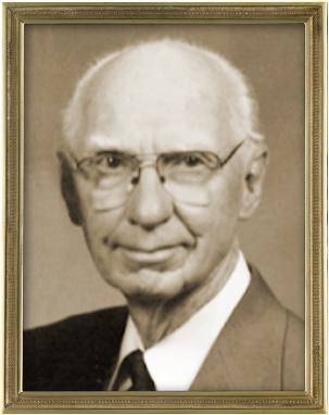 Sepia-toned portrait of an elderly man wearing glasses and a suit, framed in a gold border, suggestive of wisdom akin to the tales of elders under the stars in the constellations of the Mazzaroth.