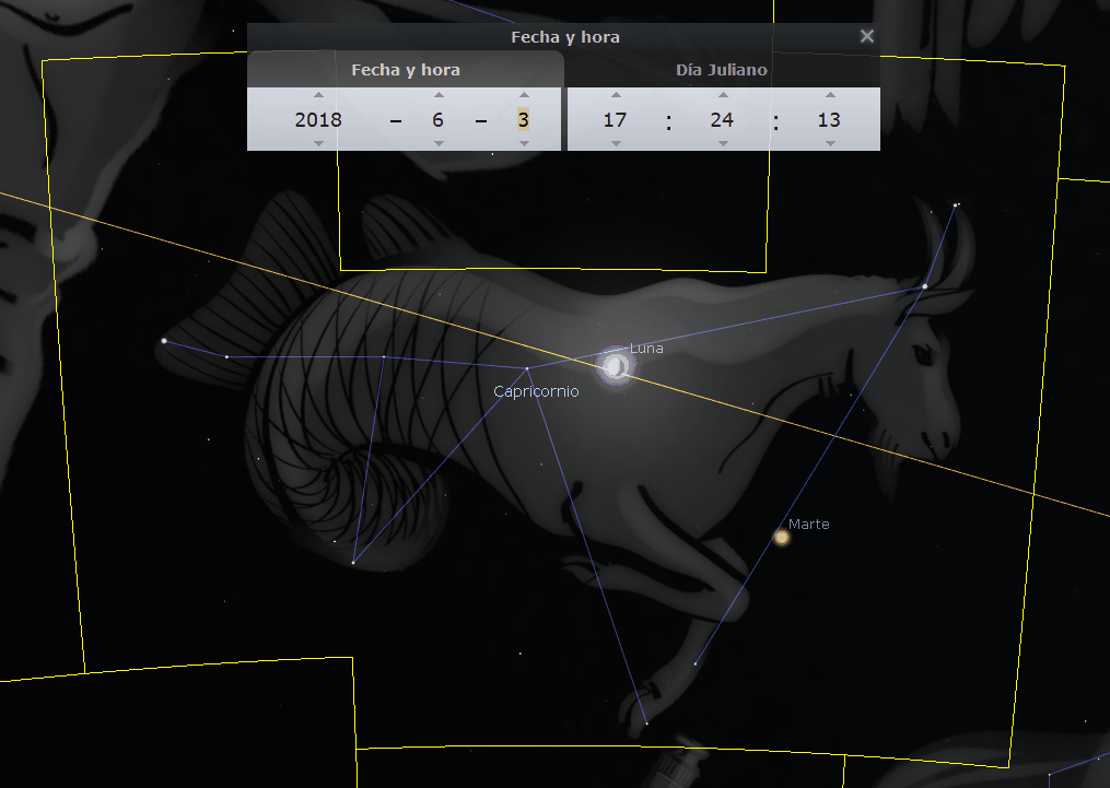 Imagen de una constelación representada como un cabrito, con líneas conectando estrellas para formar su contorno sobre un fondo oscuro estrellado. Dos objetos celestes prominentes, la Luna y Marte, están marcados, junto a una ventana emergente mostrando fecha y hora del 3 de junio de 2018.