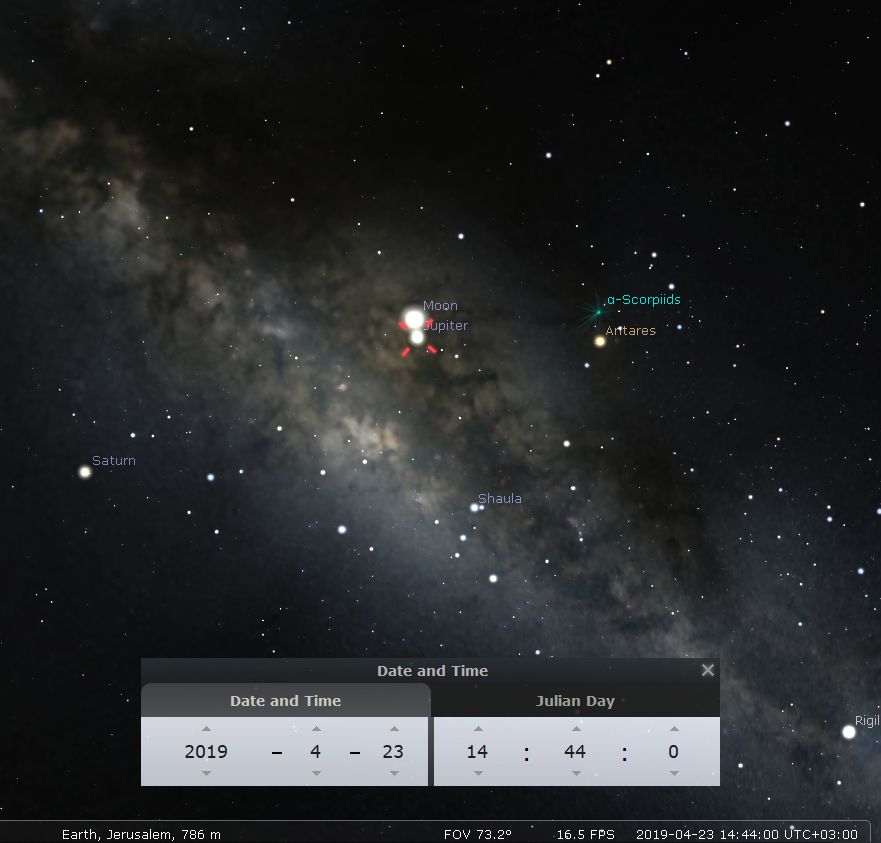 A detailed astronomical capture showing the night sky above Jerusalem, featuring the moon in close conjunction with Jupiter. Saturn appears slightly isolated to the left. Distant stars and celestial dust form a nebulous backdrop, enhancing the visibility of prominent celestial bodies. Includes an overlay showing date and time details for the celestial event, taken on 2019-04-23 at 14:44.