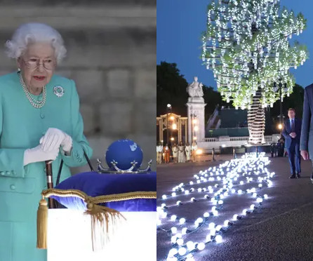 A split image with a distinguished elderly woman in a teal outfit on the left, standing next to a cushion holding a blue orb and a sword at an outdoor event. On the right, a nighttime scene of a pathway illuminated by a series of lights arranged in patterns, with a spectacular tree adorned with glowing spheres forming a unique constellation-like display.