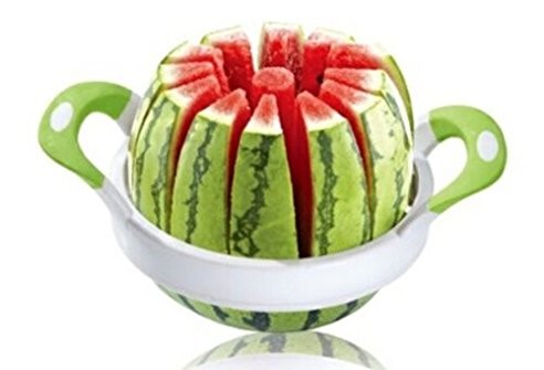 A watermelon expertly sliced into uniform segments, nestled within a white bowl with green handles, placed on a reflective surface.