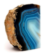 A polished agate stone, displaying concentric bands of blue and white, resembling the layered appearance of a terrestrial planet.