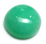 A polished green sphere with a reflective surface under colored light.