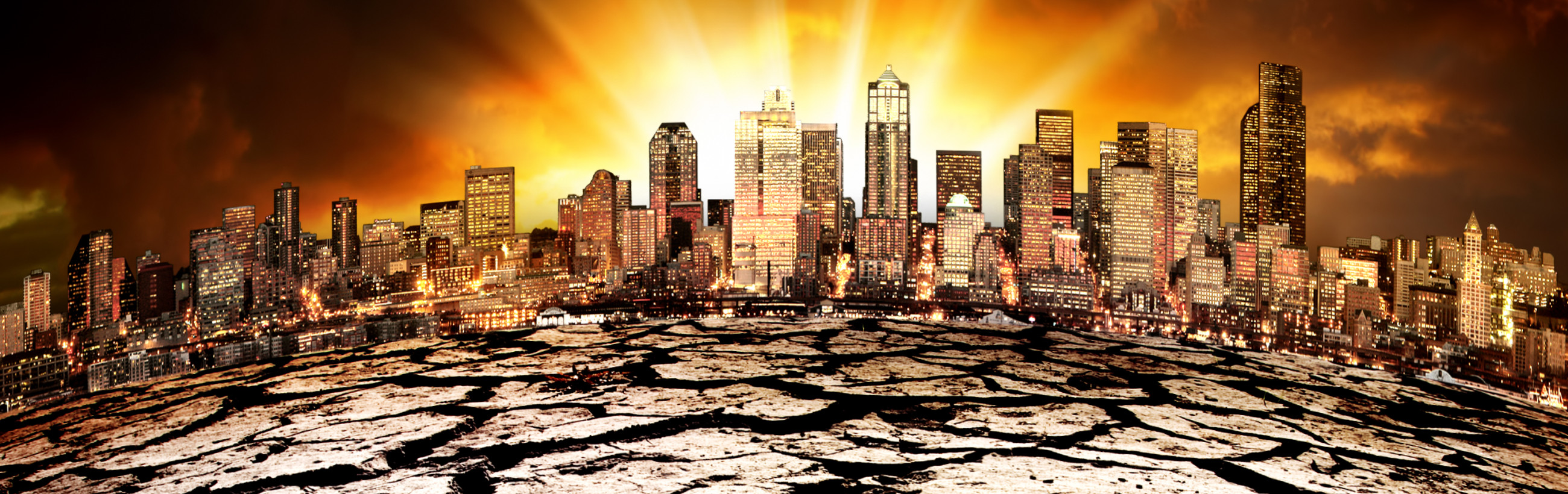 A panoramic view of a city skyline at twilight with intense orange and amber light breaking through dark clouds above. The ground in the foreground appears cracked and barren, enhancing a dramatic urban landscape.