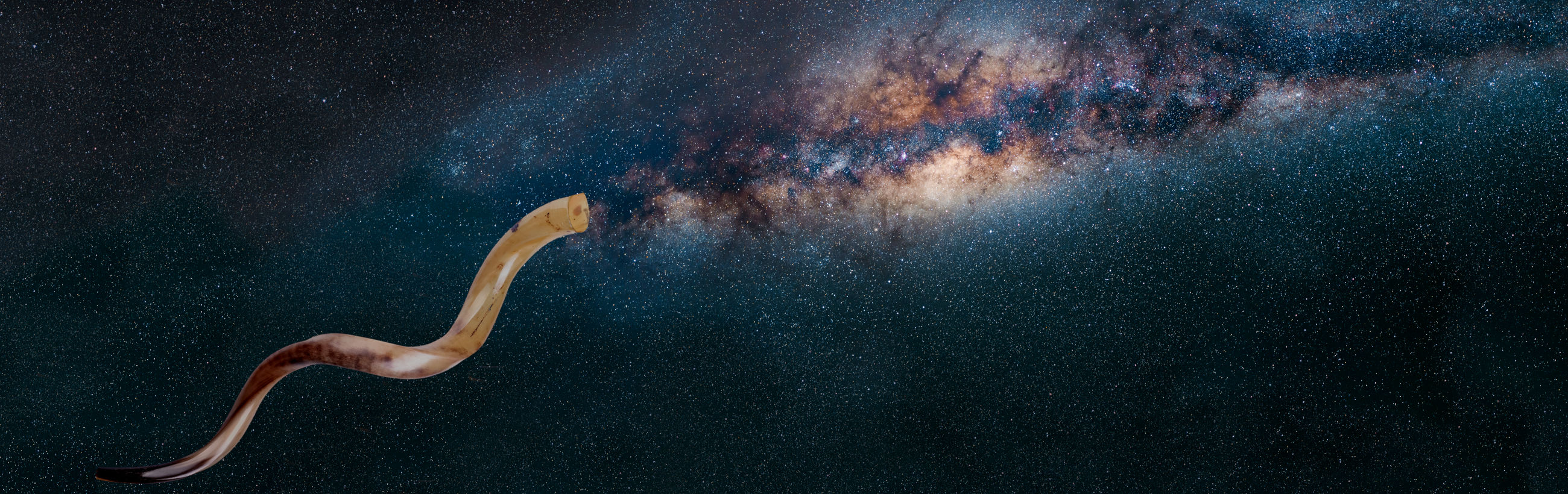 A panoramic view of the Milky Way galaxy strewn with countless stars, interstellar clouds and cosmic dust. In the foreground, a shofar with a smooth, swirled surface and two-tone coloration floats seamlessly in space.
