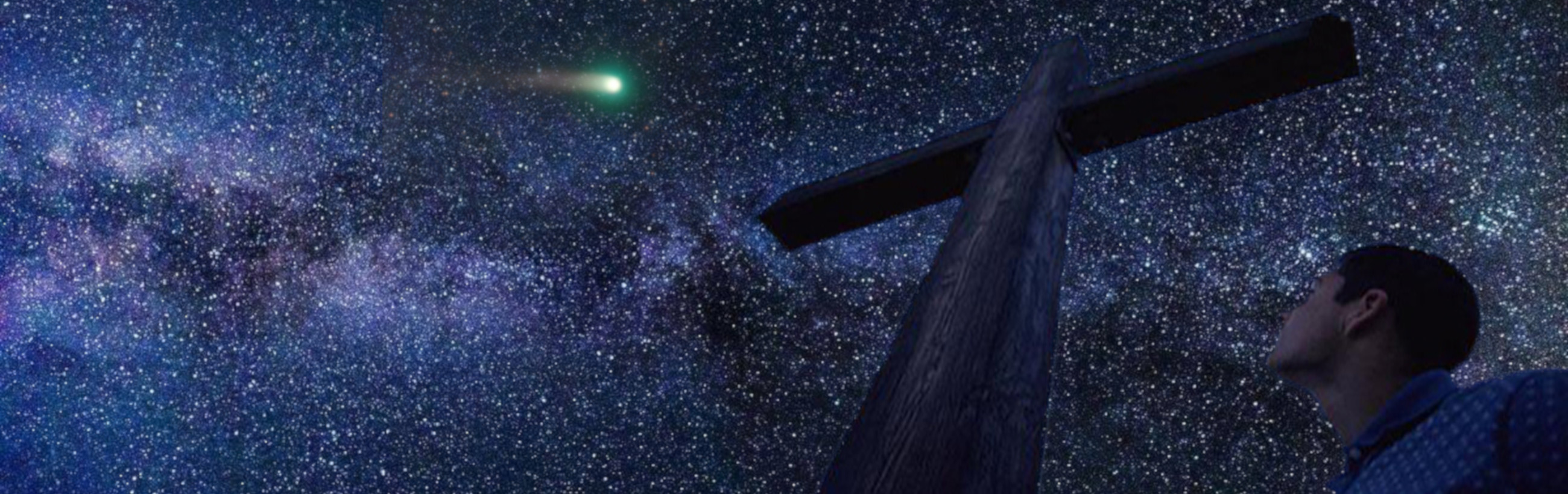 An evocative nighttime scene displaying a dense array of stars in the Milky Way galaxy, with a visible comet streaking across the sky. Nearby, a large wooden cross stands prominently, and a young man in a plaid shirt looks upward, seemingly in contemplation or prayer, invoking a sense of wonder or spiritual reflection.