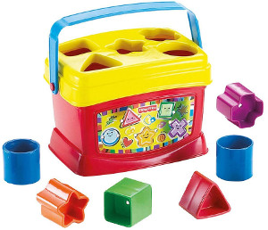 Colorful children's toy shape sorter with various shaped blocks like cylinders and cubes, intended for educational play and development of motor skills.