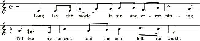 An image of a section of a musical score featuring lyrics. The music notation contains treble clefs, bar lines, notes, and rests. The lyrics shown read: "Long lay the world in sin and error pining, Till He appeared and the soul felt its worth."