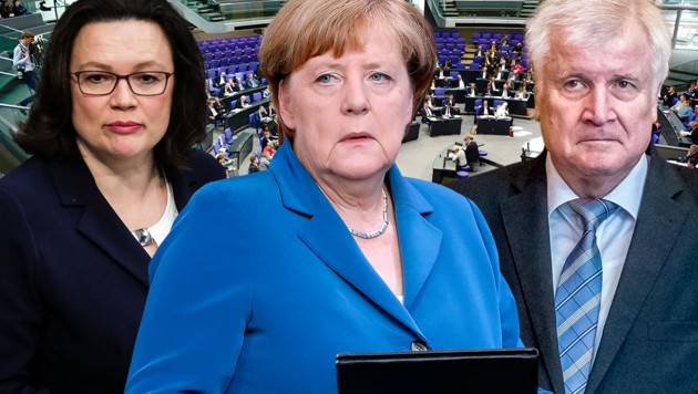 Three political figures, two women and one man, are positioned in front of an image of a parliamentary setting. The woman in the center wears a blue blazer and holds a tablet, flanked on either side by her colleagues, a woman in a dark blazer to the left and a man in a light gray blazer to the right.