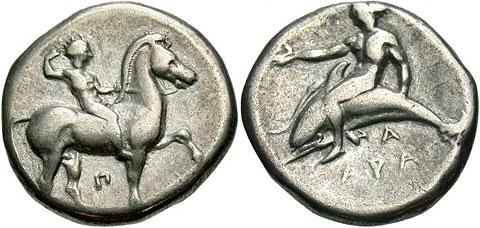 Ancient silver coin featuring a depiction of a man riding a horse on one side and a large fish with a smaller fish on the other side, both surrounded by several symbols.