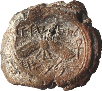 Ancient artifact representing constellations from the Mazzaroth, depicted with an engraved image of a lion along with primitive script and symbols.