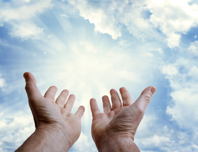 Two open hands reaching toward a radiant sun bursting through cloud cover in a vibrant blue sky, symbolizing hope or divine revelation.