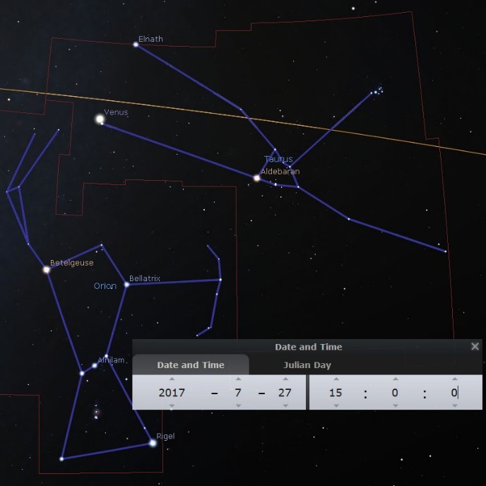 A screenshot of a digital star map displaying various celestial bodies and constellations overlaid with blue lines that outline their shapes. Visible are the stars Betelgeuse, Bellatrix, Rigel, Aldebaran, and the bright planet Venus, among others. Orange lines demarcate different sectors of the sky, and at the bottom is a dialog box showing the date and Julian day, specifically July 27, 2017, Julian Day 2457952.5.