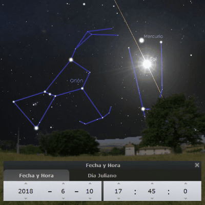 Vista nocturna del cielo mostrando la constelación de Orión con líneas conectivas entre las estrellas. Los planetas Mercurio y Sol están visibles y etiquetados. Un fondo rural con una casa y árboles bajo un cielo estrellado complementa la escena. La interfaz en primer plano muestra la fecha y hora específicas: 10 de junio de 2018, 17:45.