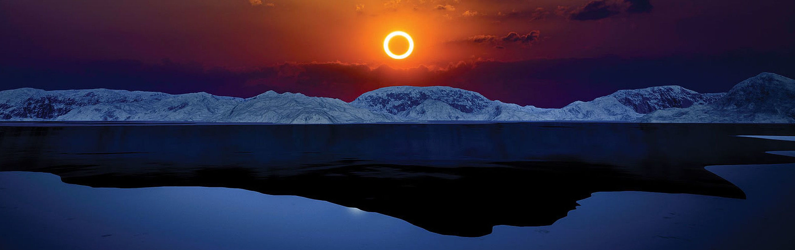 An eclipse illuminates a cold landscape with snow-covered mountains and a reflective lake under a twilight sky bathed in warm and cool hues.