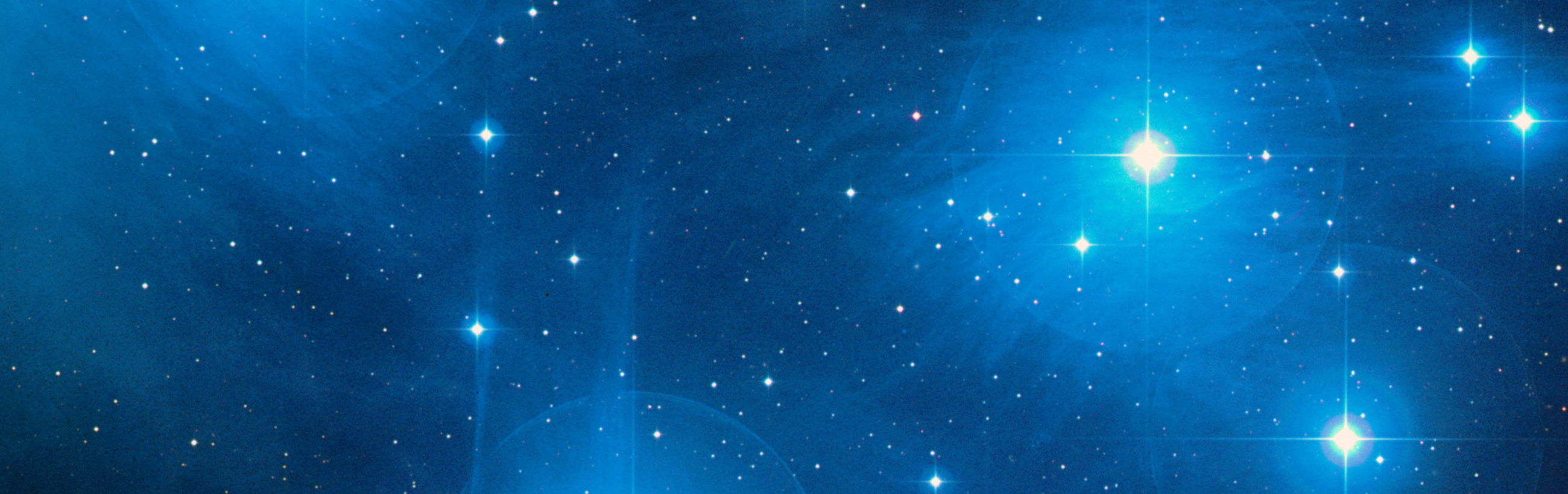 A panoramic view of a celestial arrangement featuring a radiant star cluster set against a deep blue cosmic background, illuminated by intense starlight. The image captures the splendor of stars possibly belonging to a certain array of the Mazzaroth.