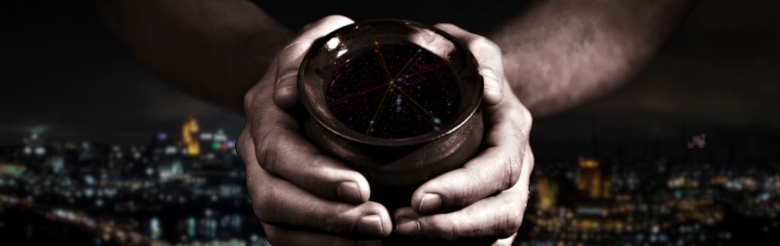 A person holds a transparent sphere depicting star constellations above a blurred cityscape at night. The sphere shows interconnected lines and dots representing a celestial map.