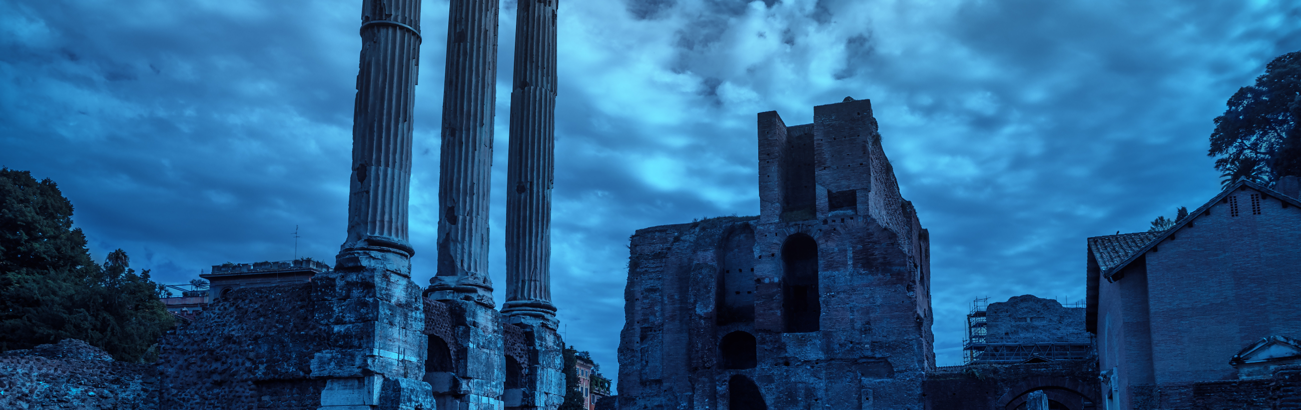 A panoramic view captured under a twilight sky featuring ancient ruins with towering columns on the left and a partially collapsed, robust stone structure on the right. Trees and modern buildings subtly merge in the background, articulating the convergence of historical epochs.