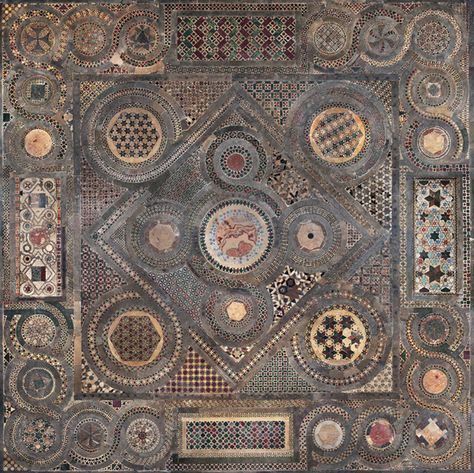 An ancient mosaic featuring a complex geometric pattern with several concentric circles and square motifs. Each segment displays a different design, incorporating a variety of colors and styles, believed to symbolically represent the Mazzaroth in a tessellated form.